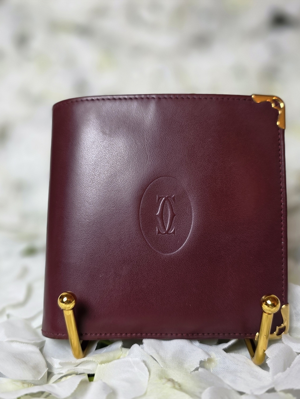 Burgundy Cartier Wallet with Embossed Logo and Gold Corners